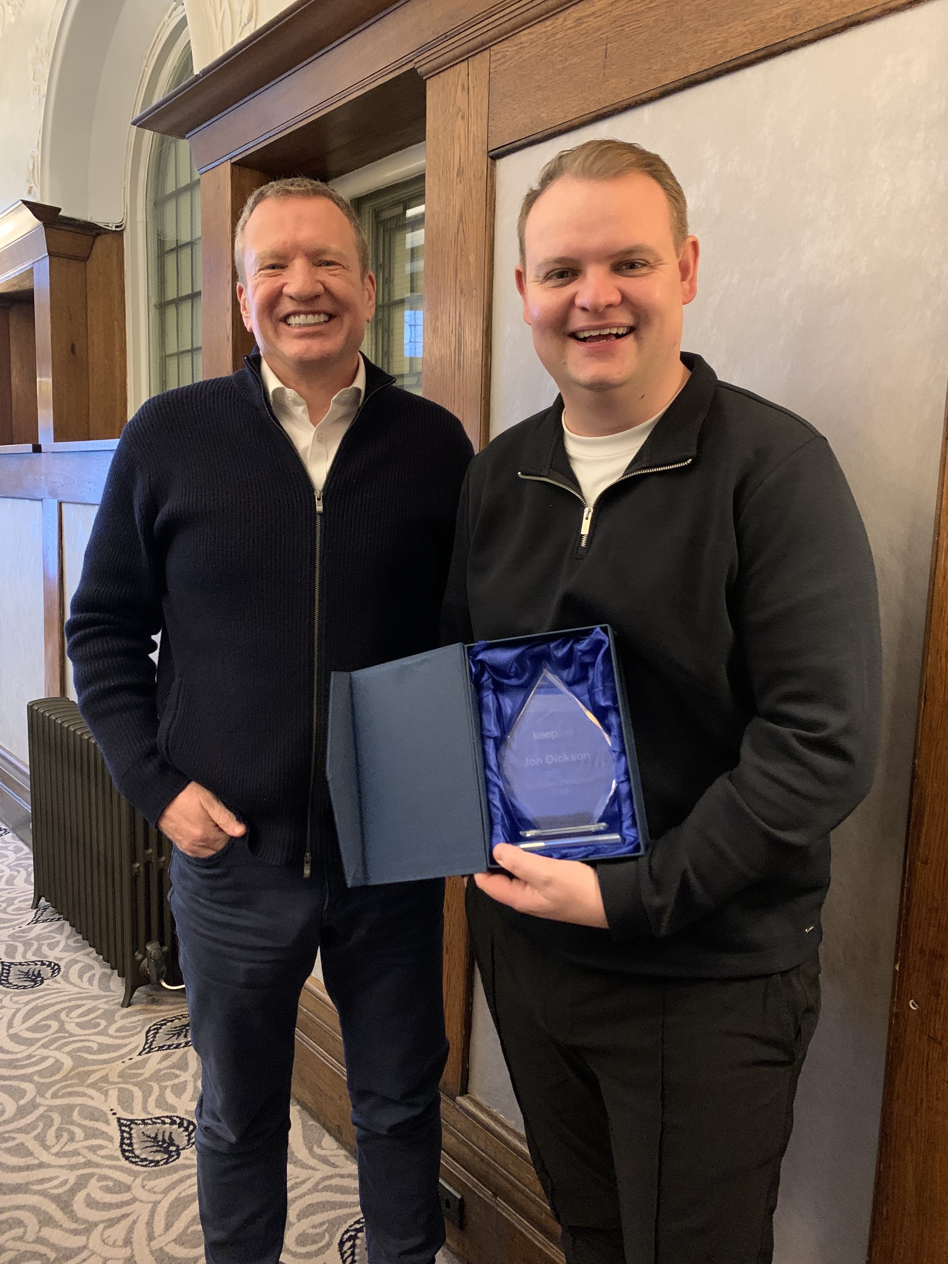 Keepme Founder & CEO Ian Mullane presents John Dickson, European Sales Director with his award for Salesperson of the Year 2023